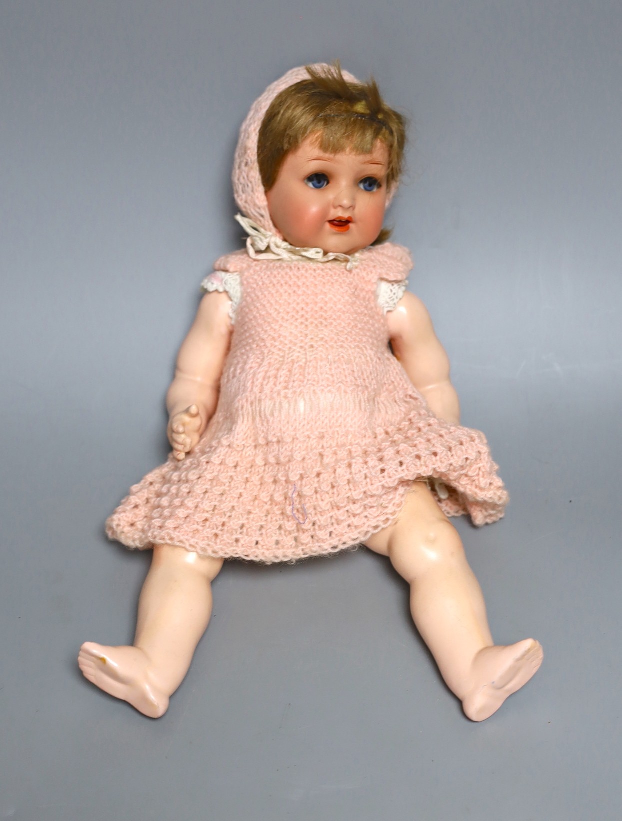 A Heubach Koppelsdorf open mouthed bisque headed doll, 34 cms high